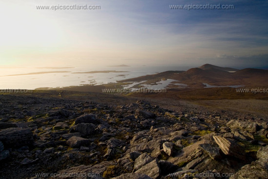 Image: From the top of Roineabhal, the highest hill in south Harris 
                         looking towards Leverburgh.
